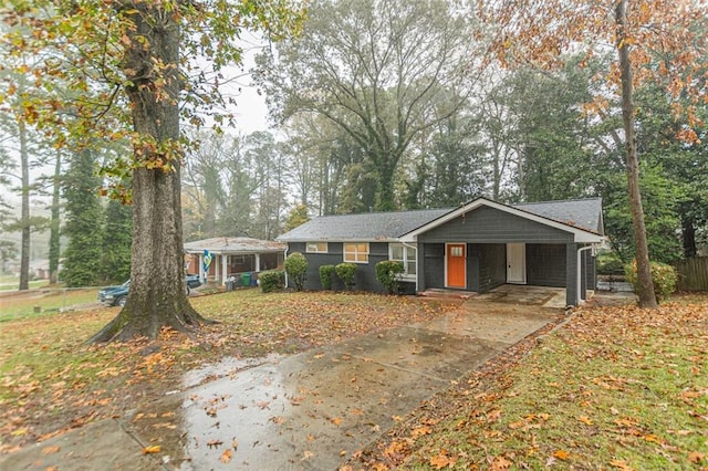 single story home featuring a carport