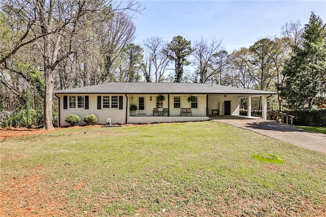ranch-style home featuring a porch, a front yard, concrete driveway, and an attached carport