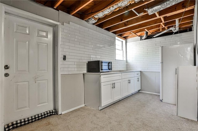 basement featuring light colored carpet