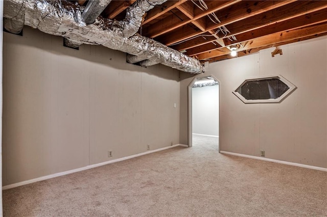finished basement featuring carpet flooring and baseboards