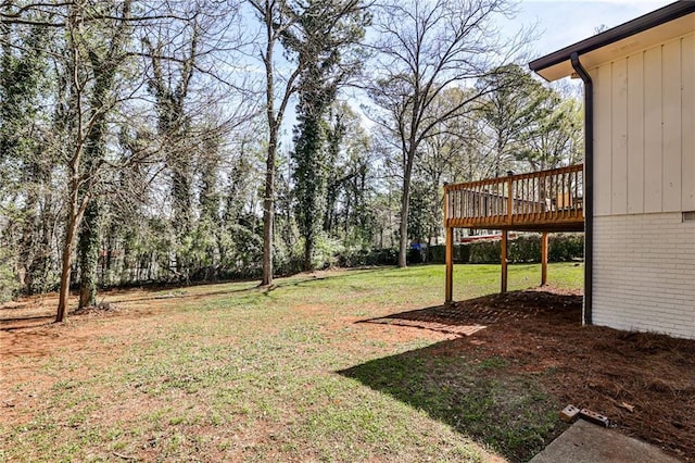 view of yard featuring a wooden deck