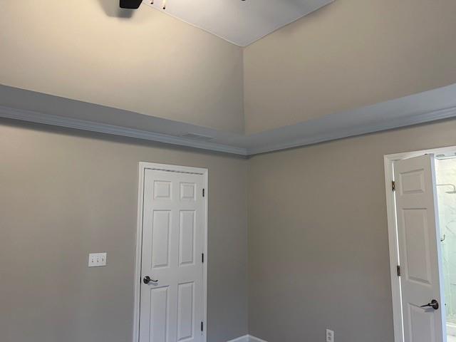 interior space with high vaulted ceiling, carpet flooring, a ceiling fan, and baseboards