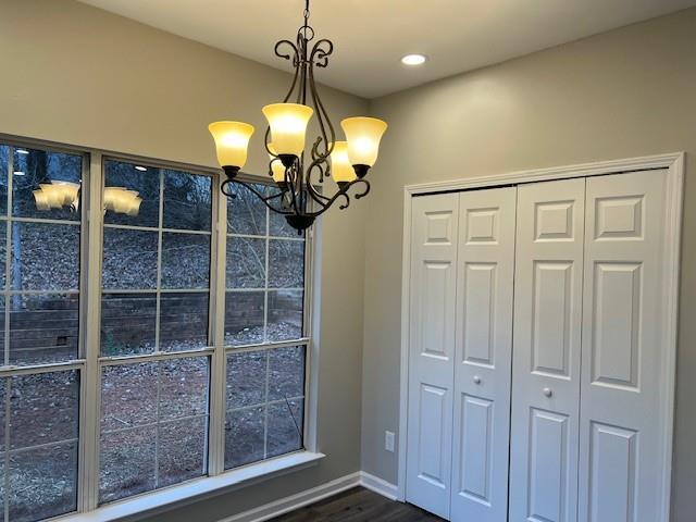 stairs featuring baseboards and wood finished floors