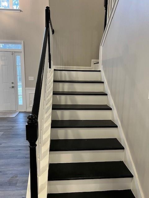 stairs featuring baseboards