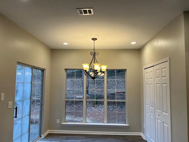 staircase featuring a towering ceiling, ornamental molding, ceiling fan, wood finished floors, and baseboards