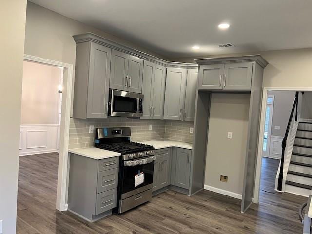 kitchen featuring stainless steel appliances and gray cabinetry