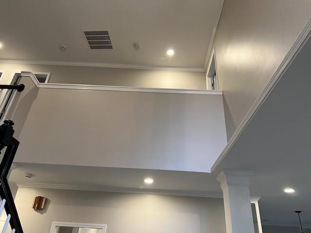 interior details featuring recessed lighting, decorative columns, visible vents, and crown molding