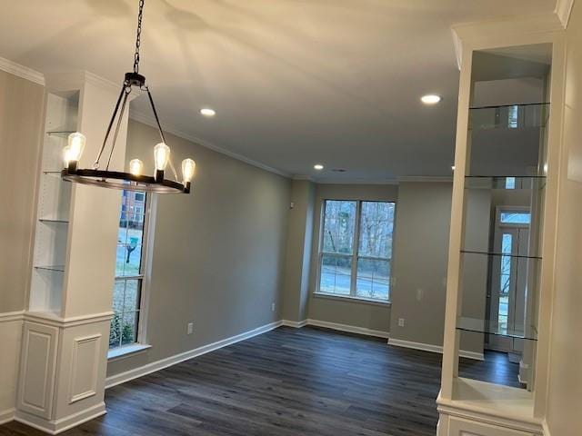 unfurnished dining area featuring dark wood-style floors, ornamental molding, recessed lighting, and baseboards