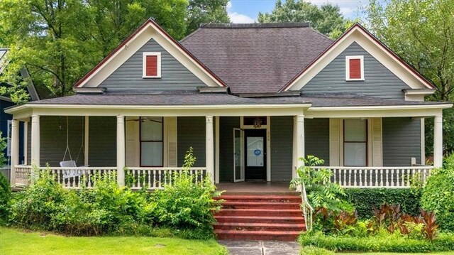 226 Noyes St, Cedartown, GA 30125 - farmhouse-style home with roof with shingles and covered porch