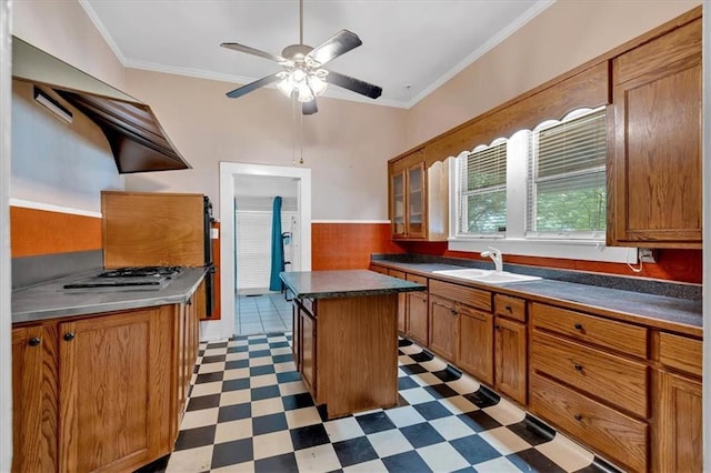 226 Noyes St, Cedartown, GA 30125 - kitchen featuring tile patterned floors, brown cabinets, ornamental molding, ceiling fan, and a center island