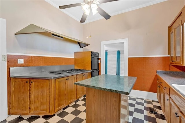 226 Noyes St, Cedartown, GA 30125 - kitchen with light flooring, brown cabinets, ceiling fan, a wainscoted wall, and crown molding