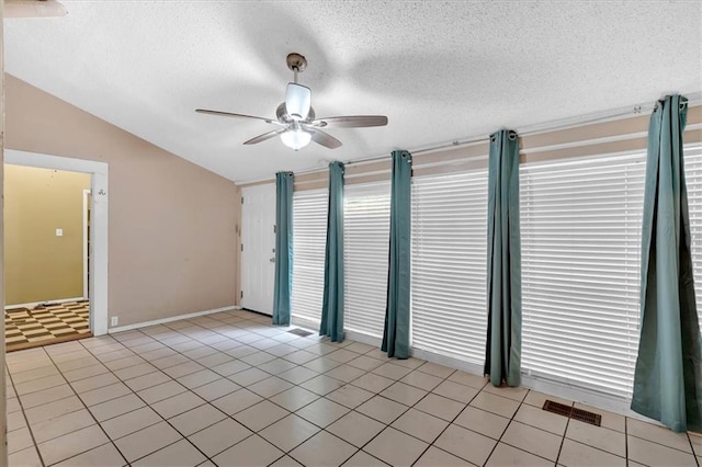 226 Noyes St, Cedartown, GA 30125 - unfurnished room featuring lofted ceiling, ceiling fan, a textured ceiling, and light tile patterned floors