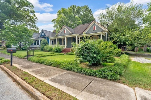 226 Noyes St, Cedartown, GA 30125 - craftsman-style house with covered porch, a front lawn, and a metal roof