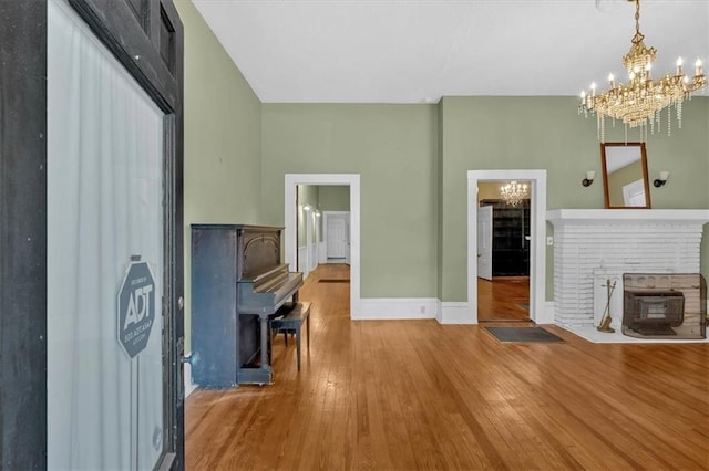 226 Noyes St, Cedartown, GA 30125 - unfurnished living room featuring a chandelier and wood finished floors