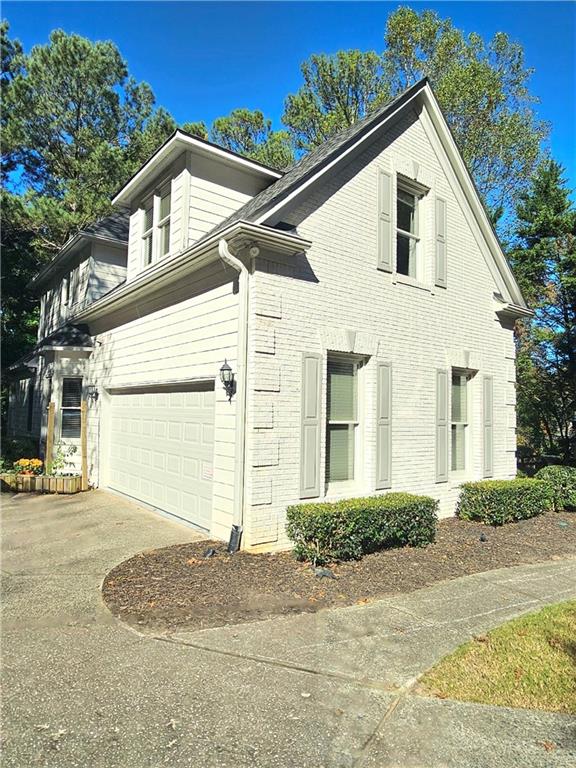 view of property exterior with a garage