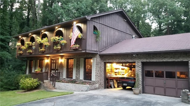 view of front of house featuring a porch and a garage