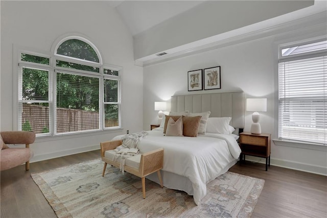 2255 Lenox Ridge Ct NE, Atlanta, GA 30319 - bedroom featuring lofted ceiling, wood finished floors, and baseboards
