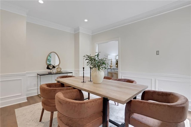 2255 Lenox Ridge Ct NE, Atlanta, GA 30319 - dining space with wood finished floors, crown molding, a decorative wall, recessed lighting, and a wainscoted wall