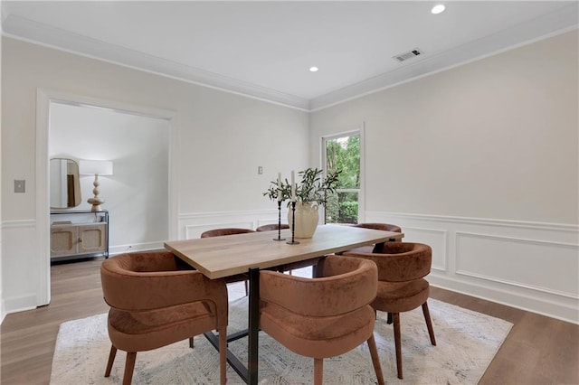 2255 Lenox Ridge Ct NE, Atlanta, GA 30319 - dining space with wood finished floors, a wainscoted wall, crown molding, recessed lighting, and a decorative wall