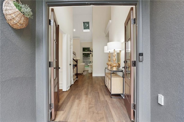 2255 Lenox Ridge Ct NE, Atlanta, GA 30319 - corridor with a textured wall, wood finished floors, and baseboards