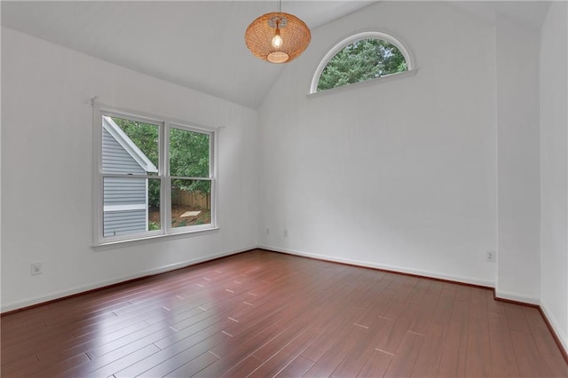 2255 Lenox Ridge Ct NE, Atlanta, GA 30319 - empty room featuring vaulted ceiling, healthy amount of natural light, wood finished floors, and baseboards
