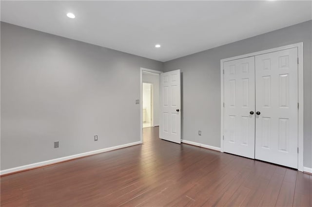 2255 Lenox Ridge Ct NE, Atlanta, GA 30319 - unfurnished bedroom with wood finished floors, baseboards, recessed lighting, and a closet