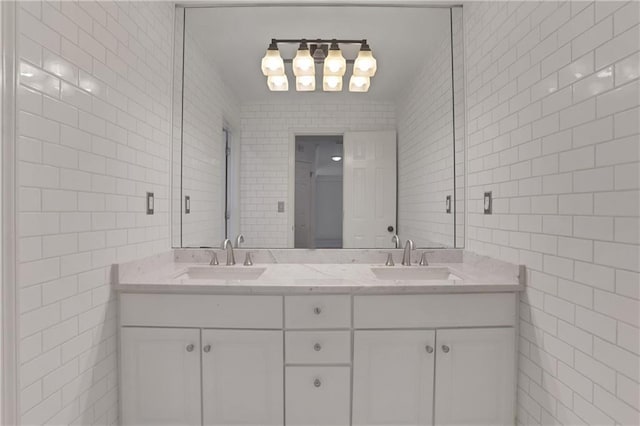2255 Lenox Ridge Ct NE, Atlanta, GA 30319 - bathroom featuring tile walls, double vanity, and a chandelier