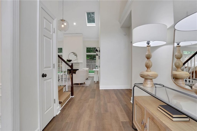 2255 Lenox Ridge Ct NE, Atlanta, GA 30319 - hall with stairway, a high ceiling, wood finished floors, and baseboards