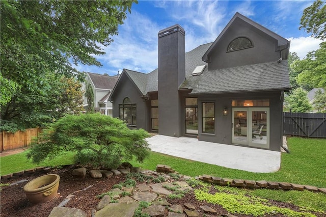 2255 Lenox Ridge Ct NE, Atlanta, GA 30319 - rear view of property with a chimney, a patio, roof with shingles, and stucco siding