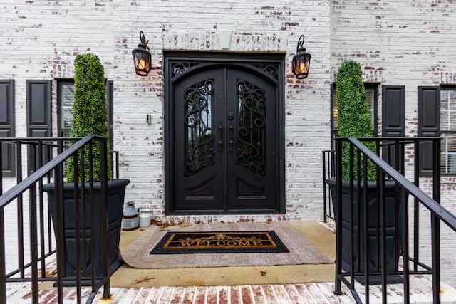 property entrance featuring french doors