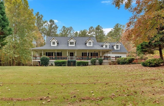 cape cod house with a front lawn and covered porch