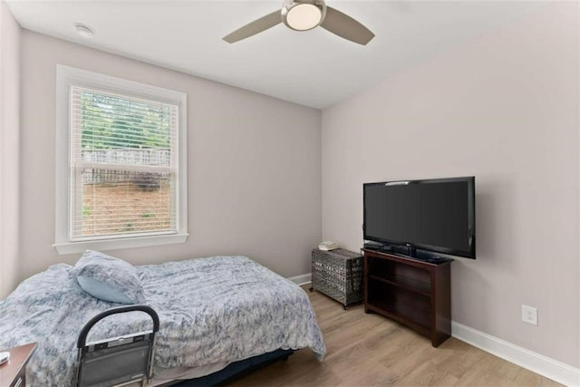 bedroom with light wood-type flooring and ceiling fan