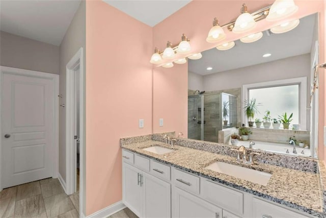 bathroom featuring vanity and separate shower and tub