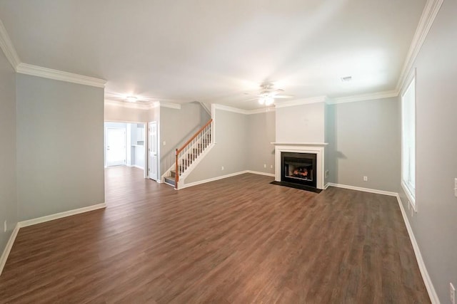 unfurnished living room with ornamental molding, ceiling fan, and dark hardwood / wood-style floors