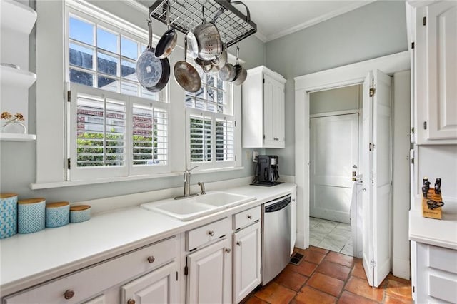 kitchen featuring white cabinetry, sink, stainless steel dishwasher, and ornamental molding