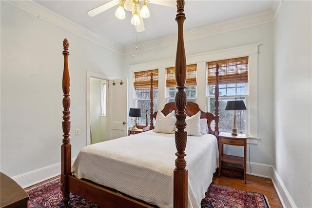 bedroom featuring crown molding, hardwood / wood-style floors, and ceiling fan