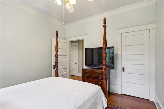 bedroom with ornamental molding, dark wood-type flooring, and ceiling fan