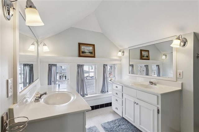 bathroom featuring vanity and vaulted ceiling