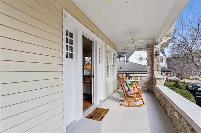 balcony featuring ceiling fan and covered porch