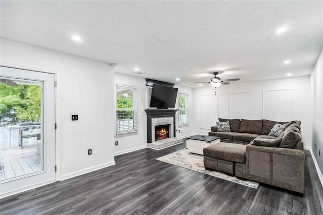 870 Underhill Ct, Sugar Hill, GA 30518 - living area with recessed lighting, dark wood-type flooring, a warm lit fireplace, baseboards, and a ceiling fan