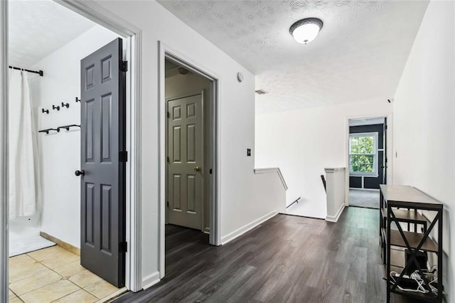 870 Underhill Ct, Sugar Hill, GA 30518 - corridor with a textured ceiling, wood finished floors, an upstairs landing, and baseboards