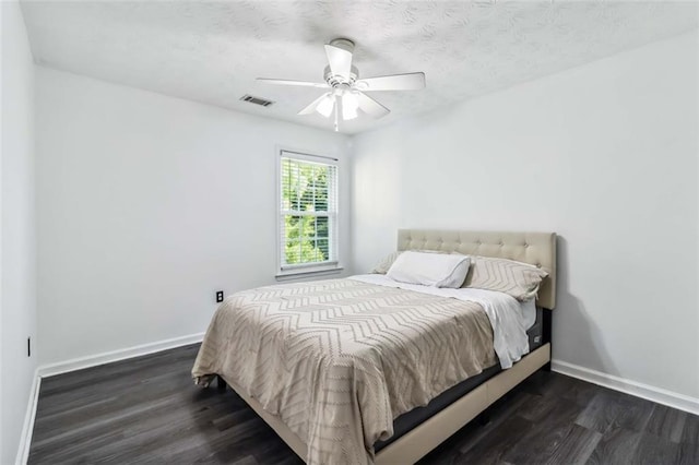 870 Underhill Ct, Sugar Hill, GA 30518 - bedroom with dark wood finished floors, baseboards, and a ceiling fan
