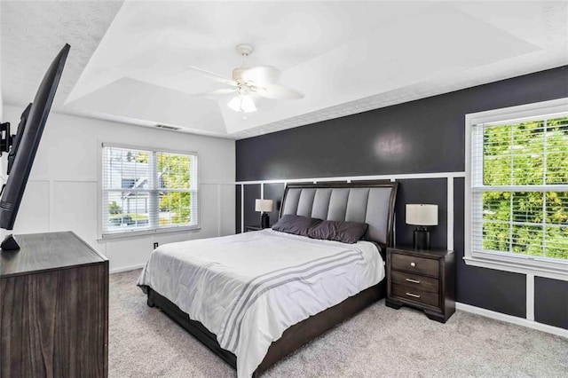 870 Underhill Ct, Sugar Hill, GA 30518 - bedroom with a tray ceiling, carpet, and multiple windows