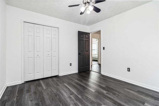 870 Underhill Ct, Sugar Hill, GA 30518 - unfurnished bedroom featuring dark wood-style floors, baseboards, and a closet