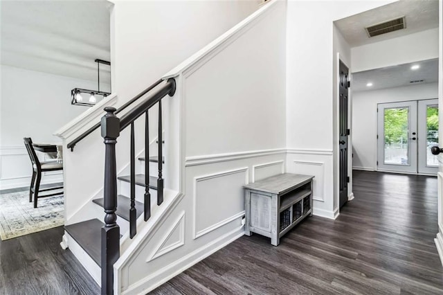 870 Underhill Ct, Sugar Hill, GA 30518 - stairway with wood finished floors, a decorative wall, a wainscoted wall, recessed lighting, and french doors