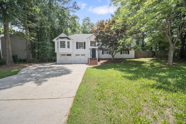990 Trestle Dr, Austell, GA 30106 - view of front facade with concrete driveway and a garage