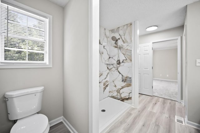 990 Trestle Dr, Austell, GA 30106 - full bathroom featuring wood finished floors and a marble finish shower