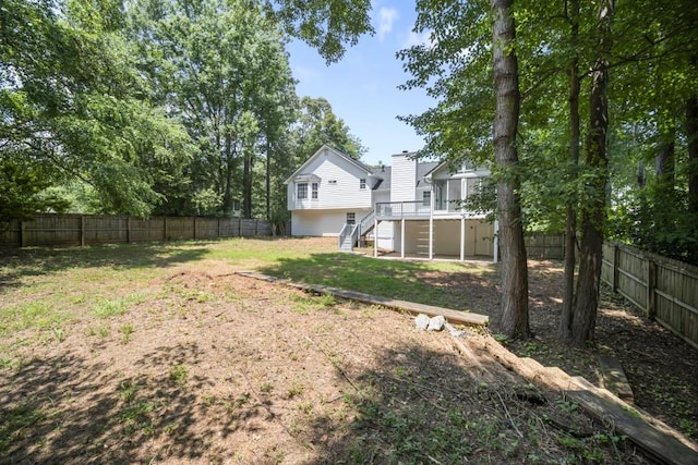 990 Trestle Dr, Austell, GA 30106 - fenced backyard featuring stairway and a wooden deck