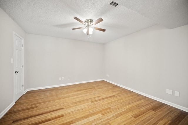 990 Trestle Dr, Austell, GA 30106 - spare room featuring a ceiling fan, light wood-type flooring, and a textured ceiling