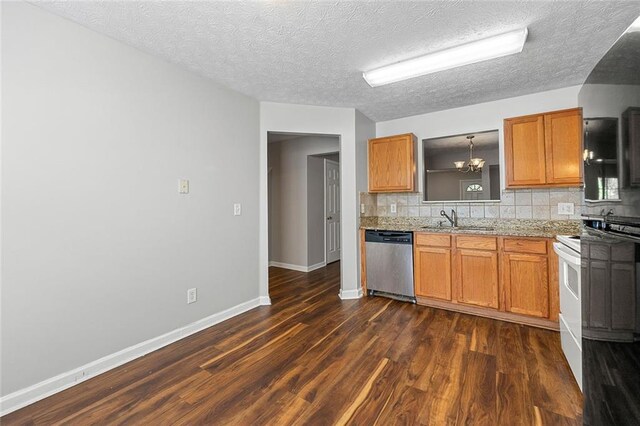 kitchen with electric range, brown cabinetry, decorative backsplash, dishwasher, and a sink